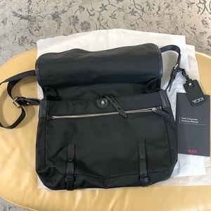 Tumi Black Messenger Bag, 2 large exterior zippered compartments, 12X15.5,clean